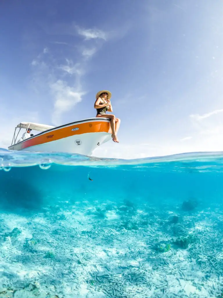 woman at the edge of a private boat charter